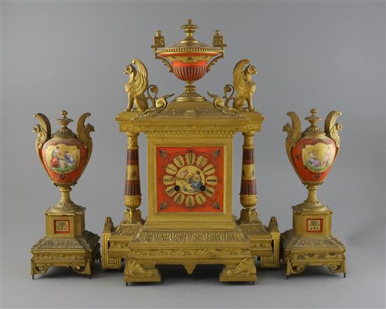 A 19th century French ormolu and porcelain classical revival clock garniture, clock H.17in. urns 11.25in.